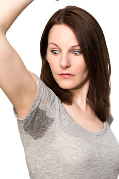 Woman sweating very badly under armpit