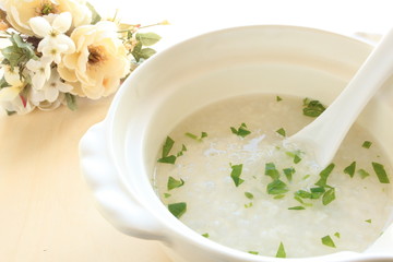 chinese cuisine, rice porridge with green leaf vegetable