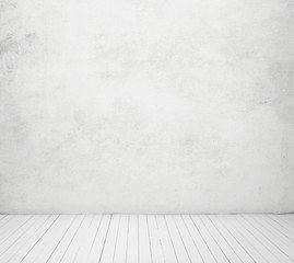 white concrete wall and wood floor