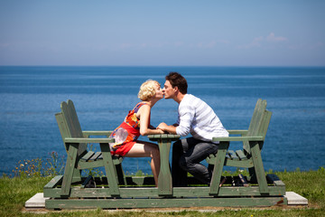 Fototapeta premium Romantic couple sitting on the bench