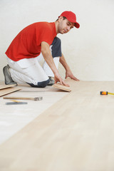 carpenter worker joining parket floor