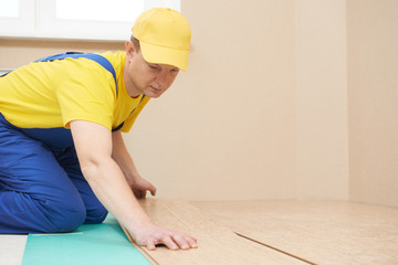 cork worker at flooring work