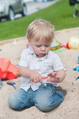 Naklejka premium Small boy playing