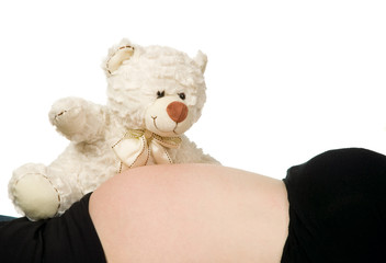 Pregnant hold bear near belly