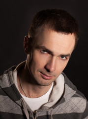 Handsome man portrait on graffiti grunge wall