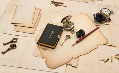 black bible book and vintage accessories