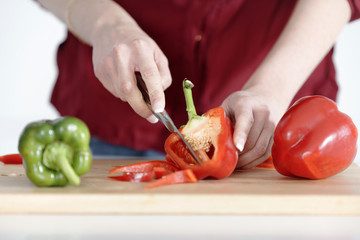 woman preparing peppers