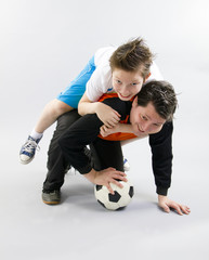 Father and son with football ball