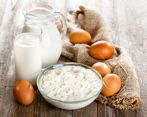 milk, cottage cheese, eggs  on wooden table