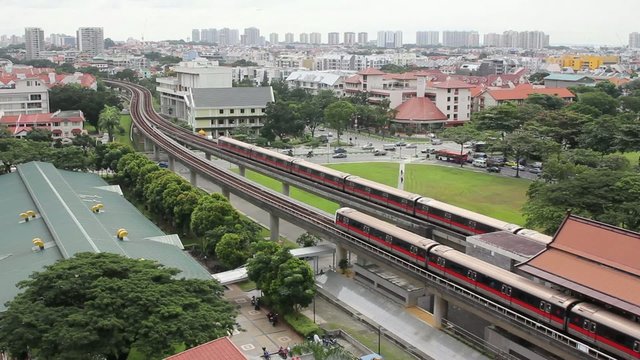 Singapore MRT Subway Trains Moving on Tracks in Eunos District