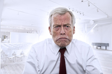 Fototapeta premium Upset Caucasian businessman with huge frown