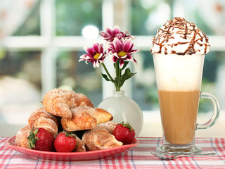delicious bagels and fresh coffee on the table close-up