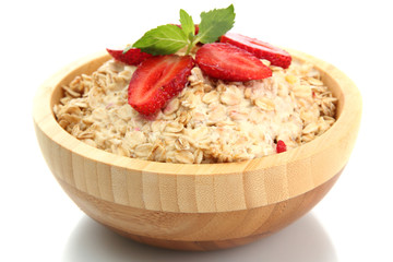tasty oatmeal with strawberries, isolated on white