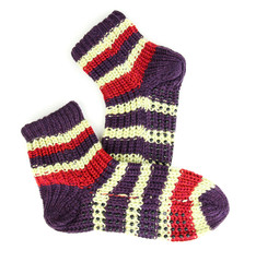 Pair of knit striped socks isolated on white