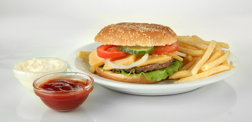 Tasty cheeseburger with fried potatoes, isolated on white