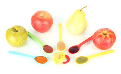 Baby puree in spoons with nipple and fruits isolated on white