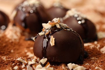 Chocolate candies with nuts, close up