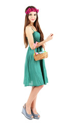 Happy female holding basket with Easter eggs, isolated on white