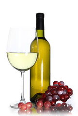 White wine glass and bottle of wine isolated on white