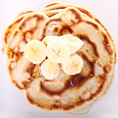 Pancakes with bananas and syrop