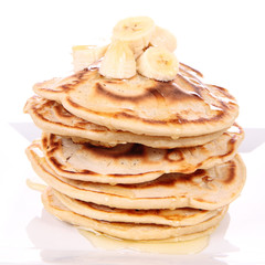 Pancakes with bananas and syrop