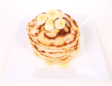 Pancakes with bananas and syrop