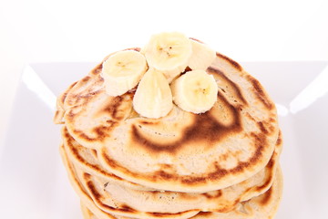 Pancakes with bananas and syrop