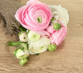 Ranunculus (persian buttercups) on wooden background
