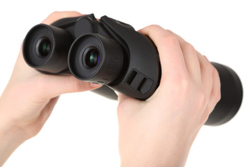 Black modern binoculars in hands isolated on white