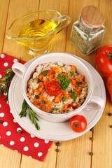 Delicious rice with vegetables and herbs in pot