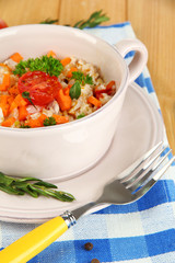 Delicious rice with vegetables and herbs in pot
