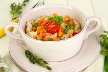 Delicious rice with vegetables and herbs in pot