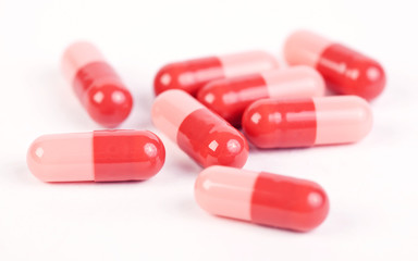 Medical capsules on white background
