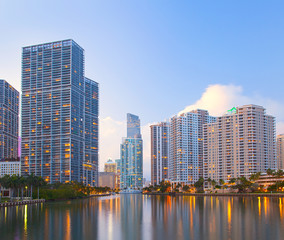 Fototapeta na wymiar Miami Florida, Brickell and downtown financial buildings over Miami River on a beautiful summer day before sunset