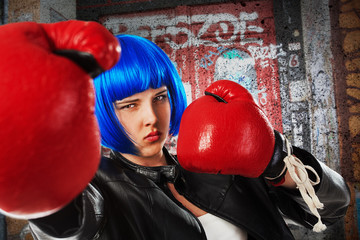 girl with blue wig and red boxing gloves