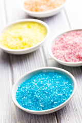 different colours of bath salt