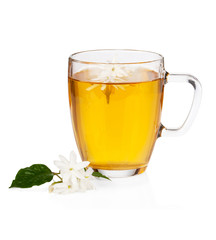 Green tea with jasmine flowers over white
