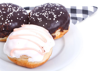 Three delicious fresh donuts in the glaze