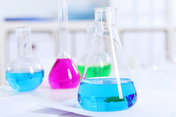 Chemistry laboratory glassware with colour liquids