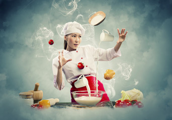 Asian female cooking with magic