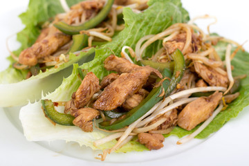 chicken sauté on lettuce