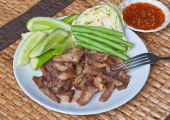 Grilled pork neck with sweet spicy sauce, Thai gourmet food.