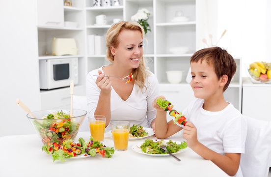 Woman and little boy having a healthy snack