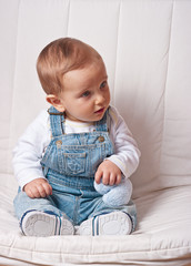 Fototapeta premium Baby boy holding a stuffed heart