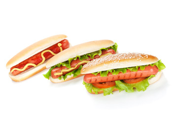 Three hot dogs with various ingredients