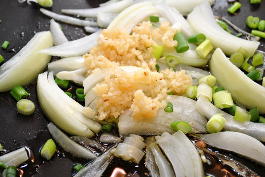 Garlic, Scallion and Onions Frying in a Pan