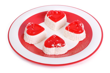 festive cheese cakes isolated on a white  on a red plate