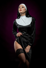 Sexy young nun posing indoors