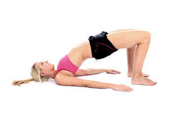 Fototapeta na wymiar Woman Pilates Shoulder Bridge Position