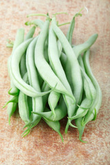 Green fresh beans on cutting board